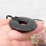 open circle black donut necklace
