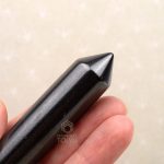 close-up of pointed tip shungite massage tool