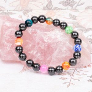 Chakra bracelet with shungite and 7 color beads on natural background