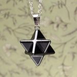 Merkaba pendant necklace close-up with stainless steel chain