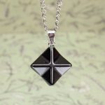 Hand-carved star-shaped pendant with chain