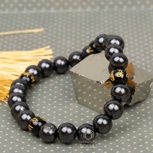 shungite feng shui bracelet close-up Tibetan script
