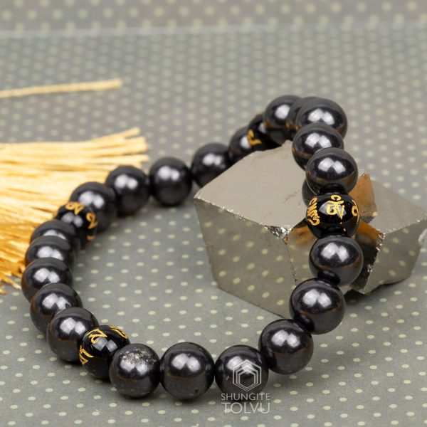 shungite feng shui bracelet close-up Tibetan script