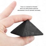 Large EMF protection shungite pyramid in hand