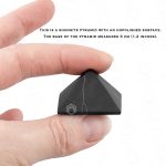 Small EMF protection shungite pyramid in hand