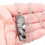 EMF protection crystal necklace worn on stainless steel chain